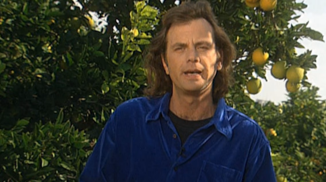 A man standing in a citrus orchard, from the documentary series It's All People